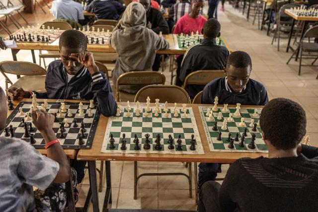 Young chess players compete during the Kibera Chess Tournament in Kibera, Nairobi, on November 15, 2025. The tournament brought together 195 children from different informal settlements, with the aim to nurture young minds, strengthen critical thinking, and inspire the next generation. (Photo by SIMON MAINA / AFP)
