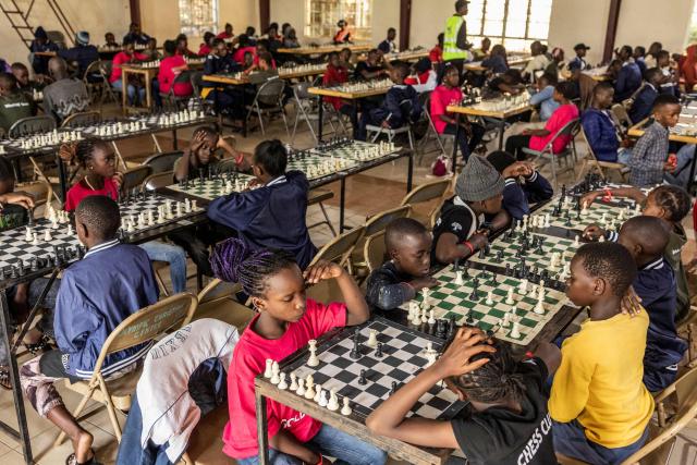 Young chess players compete during the Kibera Chess Tournament in Kibera, Nairobi, on November 15, 2025. The tournament brought together 195 children from different informal settlements, with the aim to nurture young minds, strengthen critical thinking, and inspire the next generation. (Photo by SIMON MAINA / AFP)