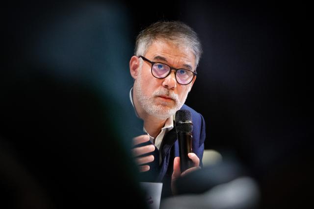 French Socialist Party (PS) first secretary Olivier Faure addresses the audience during a convention of the Front Populaire 2027 (Popular Front 2027), focused on education in Trappes,outside Paris on November 15, 2025. The united left, which is advocating a joint candidate for the 2027 presidential election, met on Saturday in Trappes to demonstrate its unbreakable unity in the face of the far right, announcing that a primary election would be held in "autumn 2026". (Photo by GEOFFROY VAN DER HASSELT / AFP)