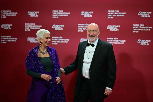 Israel's Ambassador to Germany Ron Prosor (R) and Hetty Berg, director of the Jewish Museum Berlin (JMB), pose for a photo as they arrive the awarding of the "the Prize for Understanding and Tolerance" by the Jewish Museum Berlin (JMB) in Berlin on November 15, 2025. This year, the prize goes to Amy Gutmann, former US Ambassador to Germany, Christopher H. Browne, Professor at the University of Pennsylvania and Daniel Zajfman, former President of the Weizmann Institute of Science and Chairman of the Academic Advisory Board of the Israel Science Foundation. (Photo by Tobias SCHWARZ / AFP)
