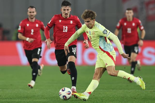 Spain's midfielder #02 Pablo Barrios shoots the ball during the FIFA World Cup 2026 European qualification football match between Georgia and Spain at the Boris Paichadze National Stadium in Tbilisi on November 15, 2025. (Photo by Giorgi ARJEVANIDZE / AFP)