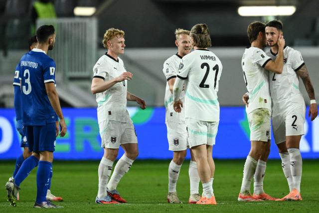 Austria's players celebrate after winning their FIFA World Cup 2026 European qualification football match against Cyprus at the Alphamega Stadium, on the outskirts of Limassol, on November 15, 2025. (Photo by Jewel SAMAD / AFP)