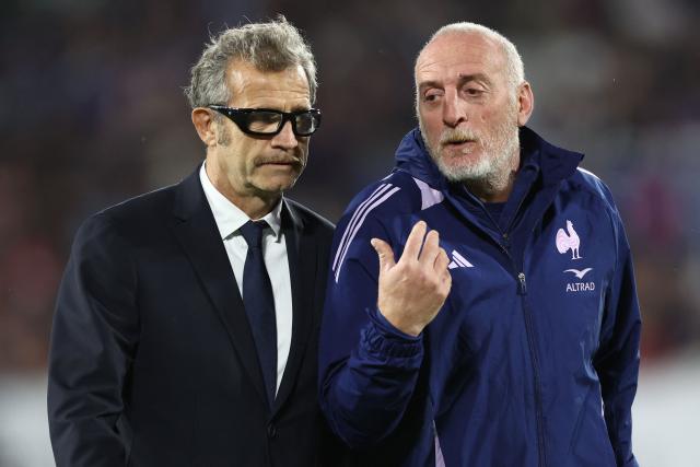 France's head coach Fabien Galthie (L) speaks with his assistant coach for attack Patrick Arlettaz ahead of the Autumn Nations Series international rugby union test match between France and Fiji, at the Atlantic Stadium Bordeaux Metropole, in Bordeaux, south-western France on November 15, 2025. (Photo by ROMAIN PERROCHEAU / AFP)