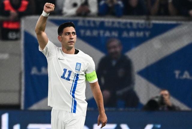 Greece's midfielder #11 Tasos Bakasetas celebrates after scoring his team's first goal during the FIFA World Cup 2026 Group C European qualification football match between Greece and Scotland at the Karaiskakis Stadium in Piraeus, on November 15, 2025. (Photo by Angelos TZORTZINIS / AFP)