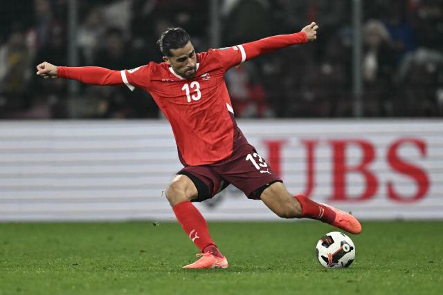 Switzerland's defender #13 Ricardo Rodriguez shoots the ball during the FIFA World Cup 2026 Group B European qualification football match between Switzerland and Sweden at the Geneva stadium, in Geneva, on November 15, 2025. (Photo by Fabrice COFFRINI / AFP)