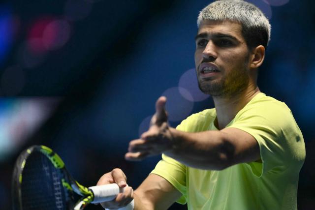 Spain's Carlos Alcaraz reacts during the semifinal match against Canada's Felix Auger-Aliassime at the ATP Finals tennis tournament in Turin on November 15, 2025. (Photo by Marco BERTORELLO / AFP)
