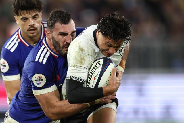 Fiji’s fly-half #10 Caleb Muntz (R) is tackled by France's lock #04 Charles Ollivon during the Autumn Nations Series international rugby union test match between France and Fiji, at the Atlantic Stadium Bordeaux Metropole, in Bordeaux, south-western France on November 15, 2025. (Photo by ROMAIN PERROCHEAU / AFP)