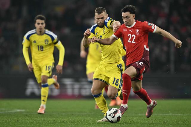 Sweden's midfielder #16 Jesper Karlstrom and Switzerland's midfielder #22 Fabian Rieder fight for the ball during the FIFA World Cup 2026 Group B European qualification football match between Switzerland and Sweden at the Geneva stadium, in Geneva, on November 15, 2025. (Photo by Fabrice COFFRINI / AFP)