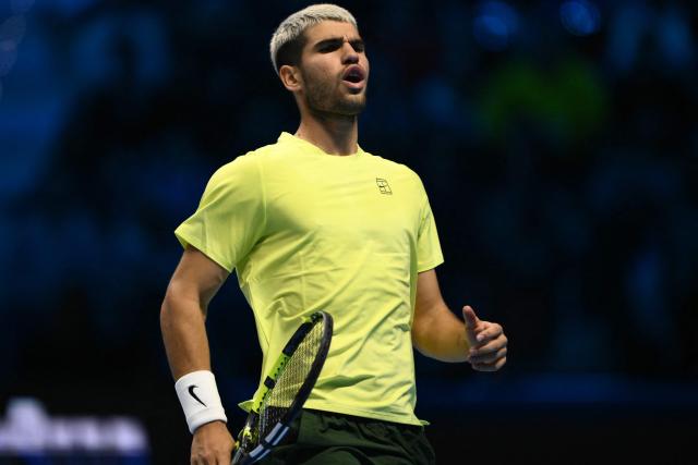 Spain's Carlos Alcaraz reacts during the semifinal match against Canada's Felix Auger-Aliassime at the ATP Finals tennis tournament in Turin on November 15, 2025. (Photo by Marco BERTORELLO / AFP)