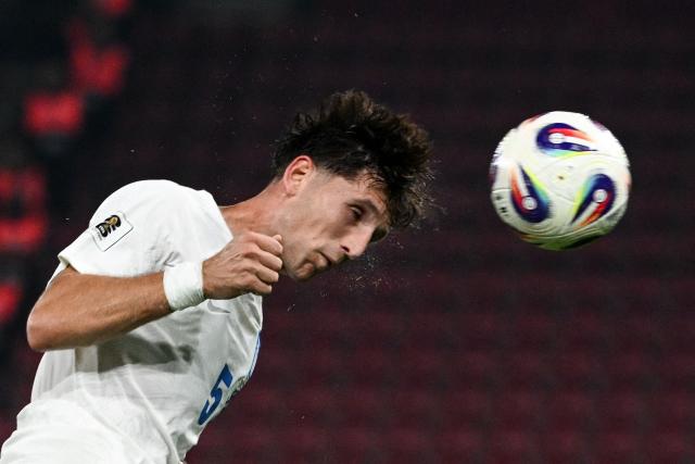 Greece's defender #05 Panagiotis Retsos heads the ball during the FIFA World Cup 2026 Group C European qualification football match between Greece and Scotland at the Karaiskakis Stadium in Piraeus, on November 15, 2025. (Photo by Angelos TZORTZINIS / AFP)