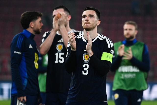 Scotland's defender and captain #03 Andrew Robertson (C) acknowledges the fans at the end of the FIFA World Cup 2026 Group C European qualification football match between Greece and Scotland at the Karaiskakis Stadium in Piraeus, on November 15, 2025. (Photo by Angelos TZORTZINIS / AFP)