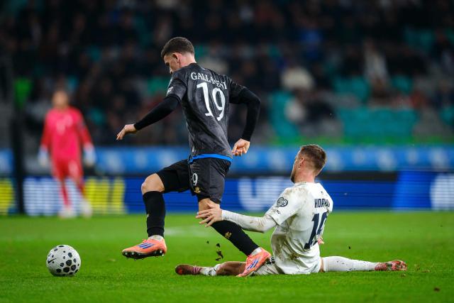Slovenia's midfielder #19 Tomi Horvat (R) and Kosovo's defender #19 Dion Gallapeni (L) fight for the ball during the FIFA World Cup 2026 Group B European qualification football match between Slovenia and Kosovo at the Stozice Stadium in Ljubljana, on November 15, 2025. (Photo by Jure Makovec / AFP)