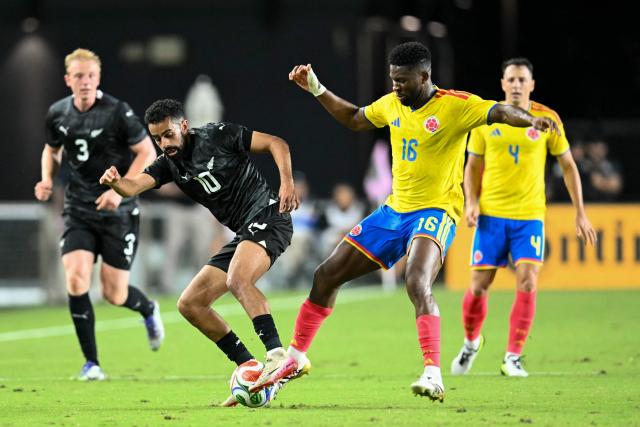 New Zealand's midfielder #10 Sarpreet Singh and Colombia's midfielder #16 Jefferson Lerma fight for the ball during the international friendly football match between Colombia and New Zealand at Chase Stadium in Fort Lauderdale, Florida, on November 15, 2025. (Photo by CHANDAN KHANNA / AFP)