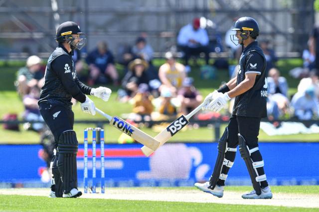 New Zealand's Devon Conway (L) and Rachin Ravindra touch bats during the first one-day international cricket match between New Zealand and West Indies at Hagley Oval in Christchurch on November 16, 2025. (Photo by Sanka Vidanagama / AFP)
