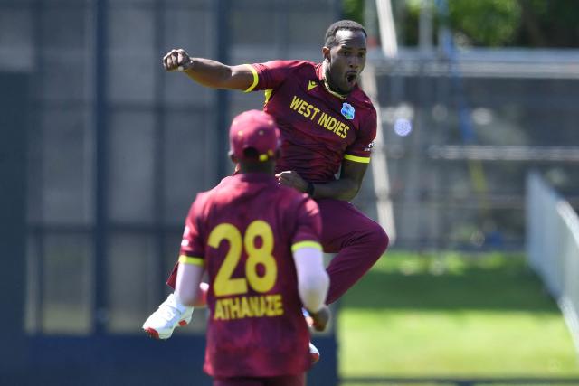 West Indies' Matthew Forde celebrates the dismissal of New Zealand's Rachin Ravindra during the first one-day international cricket match between New Zealand and West Indies at Hagley Oval in Christchurch on November 16, 2025. (Photo by Sanka Vidanagama / AFP)