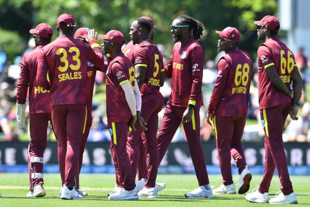 West Indies' Matthew Forde (C) and his teammates celebrate the dismissal of New Zealand's Will Young during the first one-day international cricket match between New Zealand and West Indies at Hagley Oval in Christchurch on November 16, 2025. (Photo by Sanka Vidanagama / AFP)