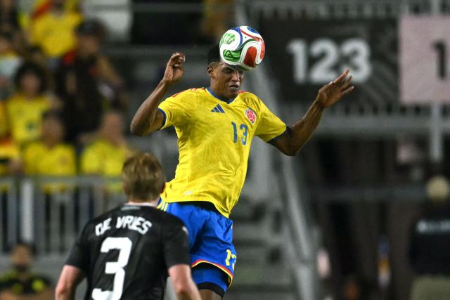Colombia's defender #13 Yerri Mina heads the ball during the international friendly football match between Colombia and New Zealand at Chase Stadium in Fort Lauderdale, Florida, on November 15, 2025. (Photo by CHANDAN KHANNA / AFP)