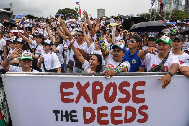 Members of religious group Iglesia ni Cristo attend an anti-corruption protest at a park in Manila on November 16, 2025. (Photo by Ted ALJIBE / AFP)