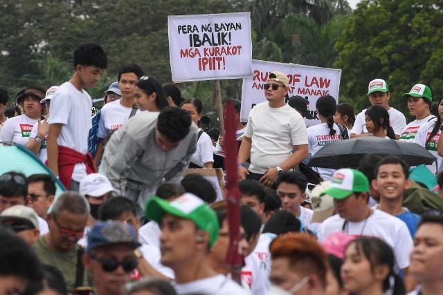 Members of religious group Iglesia ni Cristo attend an anti-corruption protest at a park in Manila on November 16, 2025. (Photo by Ted ALJIBE / AFP)
