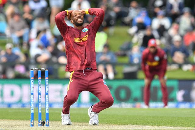 West Indies' Roston Chase reacts after his teammate Jayden Seales dropped a catch during the first one-day international cricket match between New Zealand and West Indies at Hagley Oval in Christchurch on November 16, 2025. (Photo by Sanka Vidanagama / AFP)