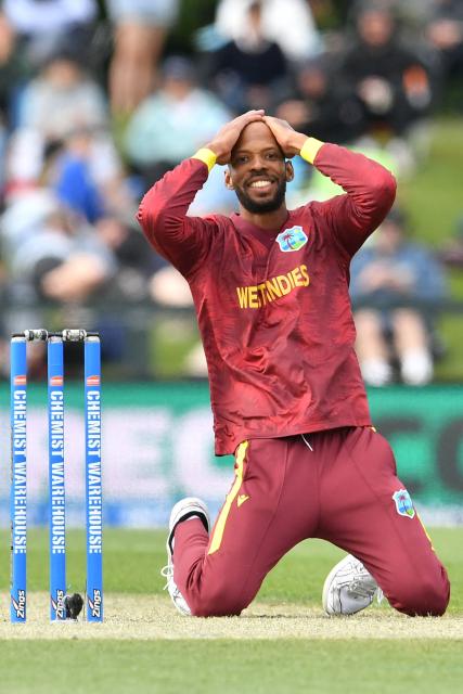 West Indies' Roston Chase reacts after his teammate Jayden Seales dropped a catch during the first one-day international cricket match between New Zealand and West Indies at Hagley Oval in Christchurch on November 16, 2025. (Photo by Sanka Vidanagama / AFP)