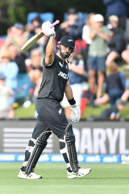 New Zealand's Daryl Mitchell walks back to the pavilion after his dismissal during the first one-day international cricket match between New Zealand and West Indies at Hagley Oval in Christchurch on November 16, 2025. (Photo by Sanka Vidanagama / AFP)