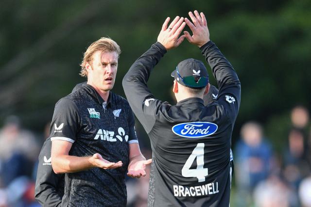 New Zealand's Kyle Jamieson (L) celebrates the dismissal of West Indies' John Campbell during the first one-day international cricket match between New Zealand and West Indies at Hagley Oval in Christchurch on November 16, 2025. (Photo by Sanka Vidanagama / AFP)
