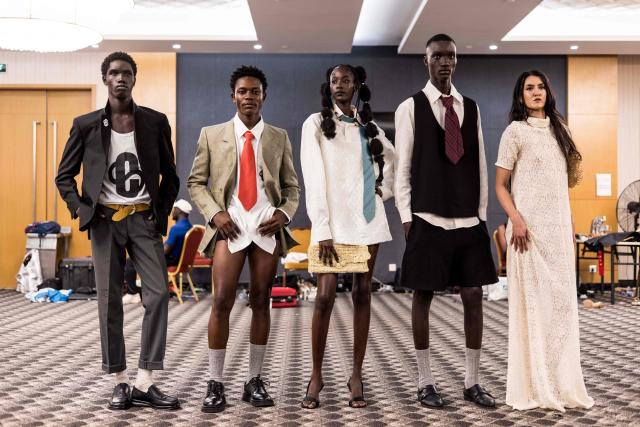 Models pose for a photograph backstage during The Gambia International Fashion Week at Sir Dawda Kairaba Jawara International Conference Centre in Banjul on November 15, 2025. (Photo by Muhamadou BITTAYE / AFP)