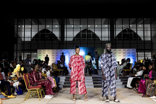Models walk the catwalk during The Gambia International Fashion Week at Sir Dawda Kairaba Jawara International Conference Centre in Banjul on November 15, 2025. (Photo by Muhamadou BITTAYE / AFP)