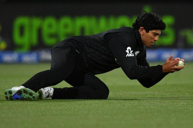 New Zealand's Rachin Ravindra catches the ball to dismiss West Indies' Shai Hope during the first one-day international cricket match between New Zealand and West Indies at Hagley Oval in Christchurch on November 16, 2025. (Photo by Sanka Vidanagama / AFP)