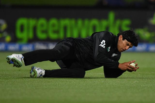 New Zealand's Rachin Ravindra catches the ball to dismiss West Indies' Shai Hope during the first one-day international cricket match between New Zealand and West Indies at Hagley Oval in Christchurch on November 16, 2025. (Photo by Sanka Vidanagama / AFP)