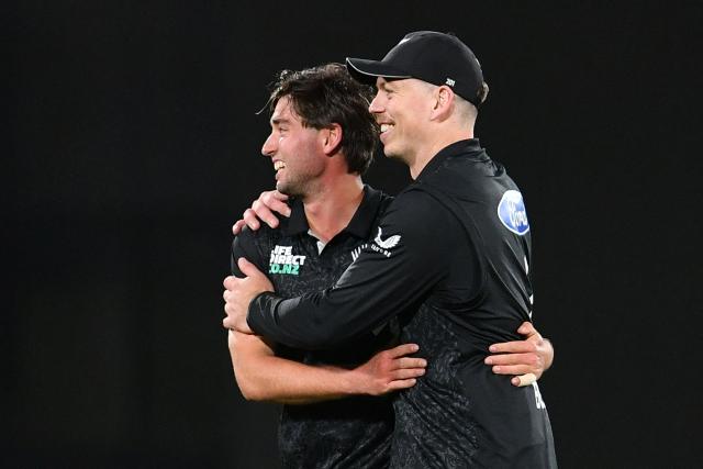 New Zealand's Zak Foulkes (L) is congratulated by his teammate Michael Bracewell after taking the wicket of  West Indies' Shai Hope during the first one-day international cricket match between New Zealand and West Indies at Hagley Oval in Christchurch on November 16, 2025. (Photo by Sanka Vidanagama / AFP)