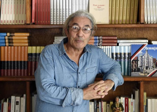 (FILES) Algerian writer Boualem Sansal poses at his home in Boumerdes, some 50 kms east of Algiers, on August 17, 2015 during an interview with AFP. Boualem Sansal could return to France "in the coming days," said French Foreign Minister Jean-Noël Barrot on November 16, 2025, according to whom this release constitutes a "resounding rebuke for the supporters of a hardline approach" in the dialogue with Algiers. (Photo by Farouk Batiche / AFP)