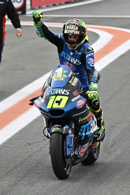 Italtrans Racing Team's Brazilian Moto2 rider Diogo Moreira celebrates becoming the new wolrd champion after winning the Moto2 race of the Valencia Grand Prix at the Ricardo Tormo racetrack in Cheste on November 16, 2025. (Photo by Javier SORIANO / AFP)