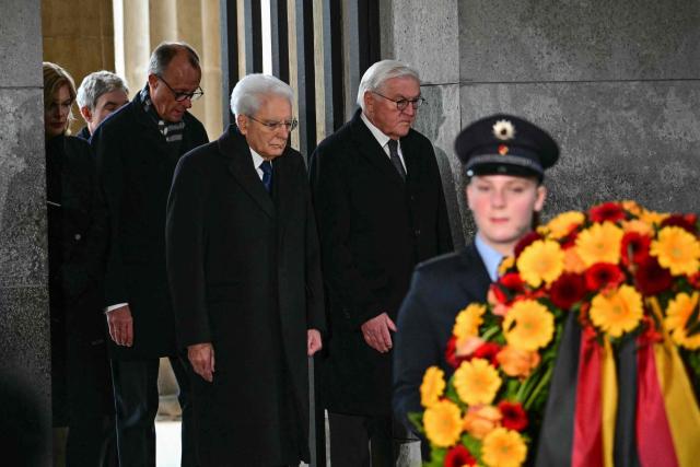 (L-R) Julia Kloeckner, President of the Bundestag (lower house of parliament), Stephan Harbarth, President of Germany's Federal Constitutional Court, German Chancellor Friedrich Merz, Italian President Sergio Mattarella and German President Frank-Walter Steinmeier attend a wreath laying ceremony on national Remembrance Day at the Neue Wache (New Guardhouse), Germany's central memorial for the victims of war and dictatorship, in Berlin on November 16, 2025. (Photo by Tobias SCHWARZ / AFP)