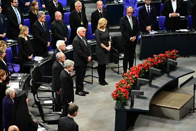 (R-L) German Chancellor Friedrich Merz, Julia Kloeckner, President of the Bundestag (lower house of parliament), German President Frank-Walter Steinmeier, Italian President Sergio Mattarella, Wolfgang Schneiderhan, President of the German War Graves Commission and Stephan Harbarth, President of Germany's Federal Constitutional Court are pictured during a ceremony on national Remembrance Day at the Bundestag (lower house of parliament) in the Reichstag building in Berlin on November 16, 2025. (Photo by Tobias SCHWARZ / AFP)