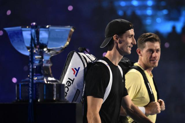British Joe Salisbury and British Neal Skupski arrive to play the final of the double against British Henry Patten and Finnish Harri Heliovaara at the ATP Finals tennis tournament in Turin on November 16, 2025. (Photo by Marco BERTORELLO / AFP)