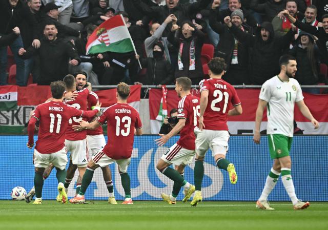 Hungary's forward #16 Daniel Lukacs (2nd L) celebrates his 1-0 with team mates during the FIFA World Cup 2026 Group F European qualification football match betweem Hungary and Republic of Ireland at the Puskas Arena in Budapest, Hungary on Novemeber 16, 2025. (Photo by Attila KISBENEDEK / AFP)