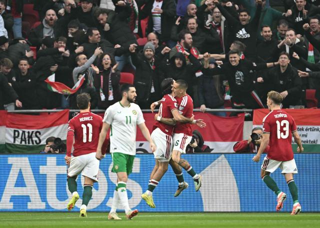 Hungary's forward #16 Daniel Lukacs (C R) celebrates his 1-0 with Hungary's midfielder #10 Dominik Szoboszlai (C L) during the FIFA World Cup 2026 Group F European qualification football match betweem Hungary and Republic of Ireland at the Puskas Arena in Budapest, Hungary on Novemeber 16, 2025. (Photo by Attila KISBENEDEK / AFP)