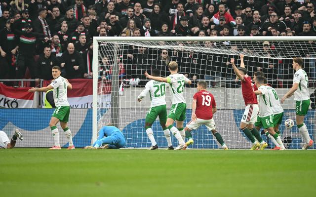 Republic of Ireland's players react to the 1-0 during the FIFA World Cup 2026 Group F European qualification football match betweem Hungary and Republic of Ireland at the Puskas Arena in Budapest, Hungary on Novemeber 16, 2025. (Photo by Attila KISBENEDEK / AFP)