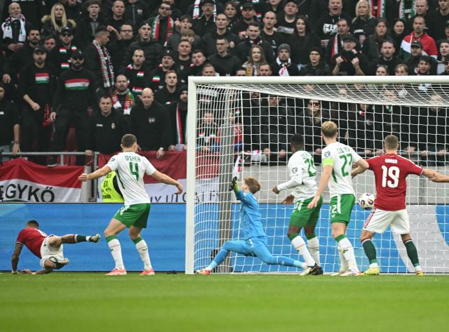 Hungary's forward #16 Daniel Lukacs (L) scores the 1-0 during the FIFA World Cup 2026 Group F European qualification football match betweem Hungary and Republic of Ireland at the Puskas Arena in Budapest, Hungary on Novemeber 16, 2025. (Photo by Attila KISBENEDEK / AFP)
