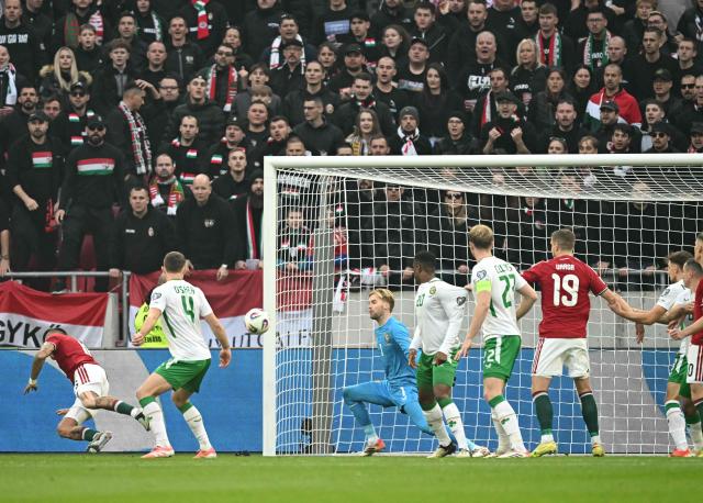 Hungary's forward #16 Daniel Lukacs (L) scores the 1-0 during the FIFA World Cup 2026 Group F European qualification football match betweem Hungary and Republic of Ireland at the Puskas Arena in Budapest, Hungary on Novemeber 16, 2025. (Photo by Attila KISBENEDEK / AFP)