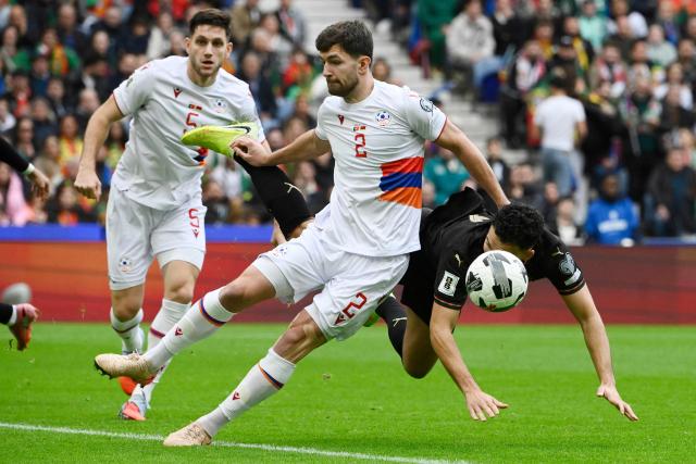 Armenia's defender #02 Sergei Muradian fights for the ball with Portugal's forward #09 Goncalo Ramos during the 2026 World Cup qualifiers Europe zone group F football match between Portugal and Armenia, at Dragao stadium in Porto on November 16, 2025. (Photo by Miguel RIOPA / AFP)