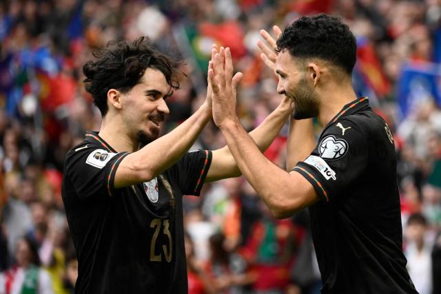 Portugal's forward #09 Goncalo Ramos (R) celebrates his team's second goal during the 2026 World Cup qualifiers Europe zone group F football match between Portugal and Armenia, at Dragao stadium in Porto on November 16, 2025. (Photo by Miguel RIOPA / AFP)
