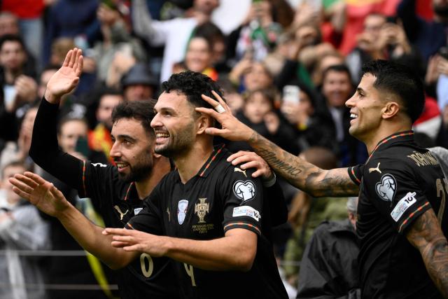 Portugal's forward #09 Goncalo Ramos (C) celebrates his team's second goal during the 2026 World Cup qualifiers Europe zone group F football match between Portugal and Armenia, at Dragao stadium in Porto on November 16, 2025. (Photo by Miguel RIOPA / AFP)