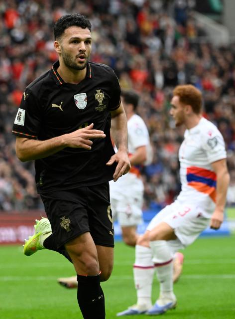 Portugal's forward #09 Goncalo Ramos celebrates his team's second goal during the 2026 World Cup qualifiers Europe zone group F football match between Portugal and Armenia, at Dragao stadium in Porto on November 16, 2025. (Photo by Miguel RIOPA / AFP)