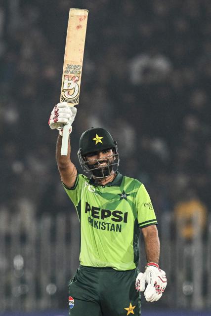 Pakistan's Fakhar Zaman celebrates after scoring a half-century (50 runs) during the third one-day international (ODI) cricket match between Pakistan and Sri Lanka at the Rawalpindi Cricket Stadium in Rawalpindi on November 16, 2025. (Photo by Aamir QURESHI / AFP)