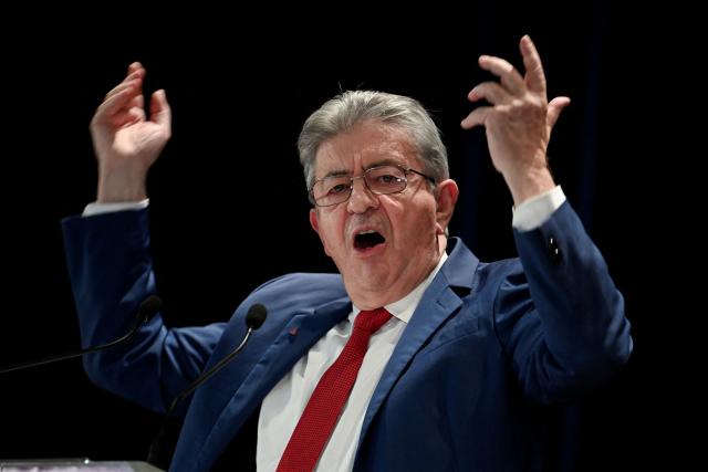 Founder of French left-wing party La France Insoumise (LFI) Jean-Luc Melenchon gestures as he gives a speech during a LFI meeting in Saint-Pierre-des-Corps, central France, on November 16, 2025. (Photo by JEAN-FRANCOIS MONIER / AFP)
