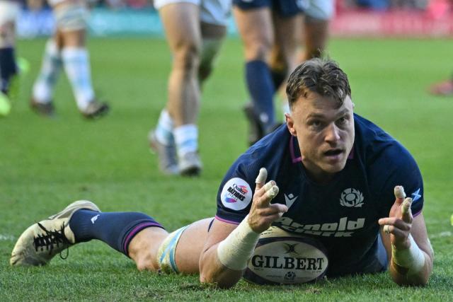 Scotland's number 8 Jack Dempsey celebrates after scoring their first try during the Autumn Nations Series international rugby union match between Scotland and Argentina at Murrayfield in Edinburgh on November 16, 2025. (Photo by ANDY BUCHANAN / AFP)