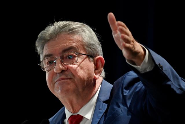 Founder of French left-wing party La France Insoumise (LFI) Jean-Luc Melenchon gestures as he gives a speech during a LFI meeting in Saint-Pierre-des-Corps, central France, on November 16, 2025. (Photo by JEAN-FRANCOIS MONIER / AFP)